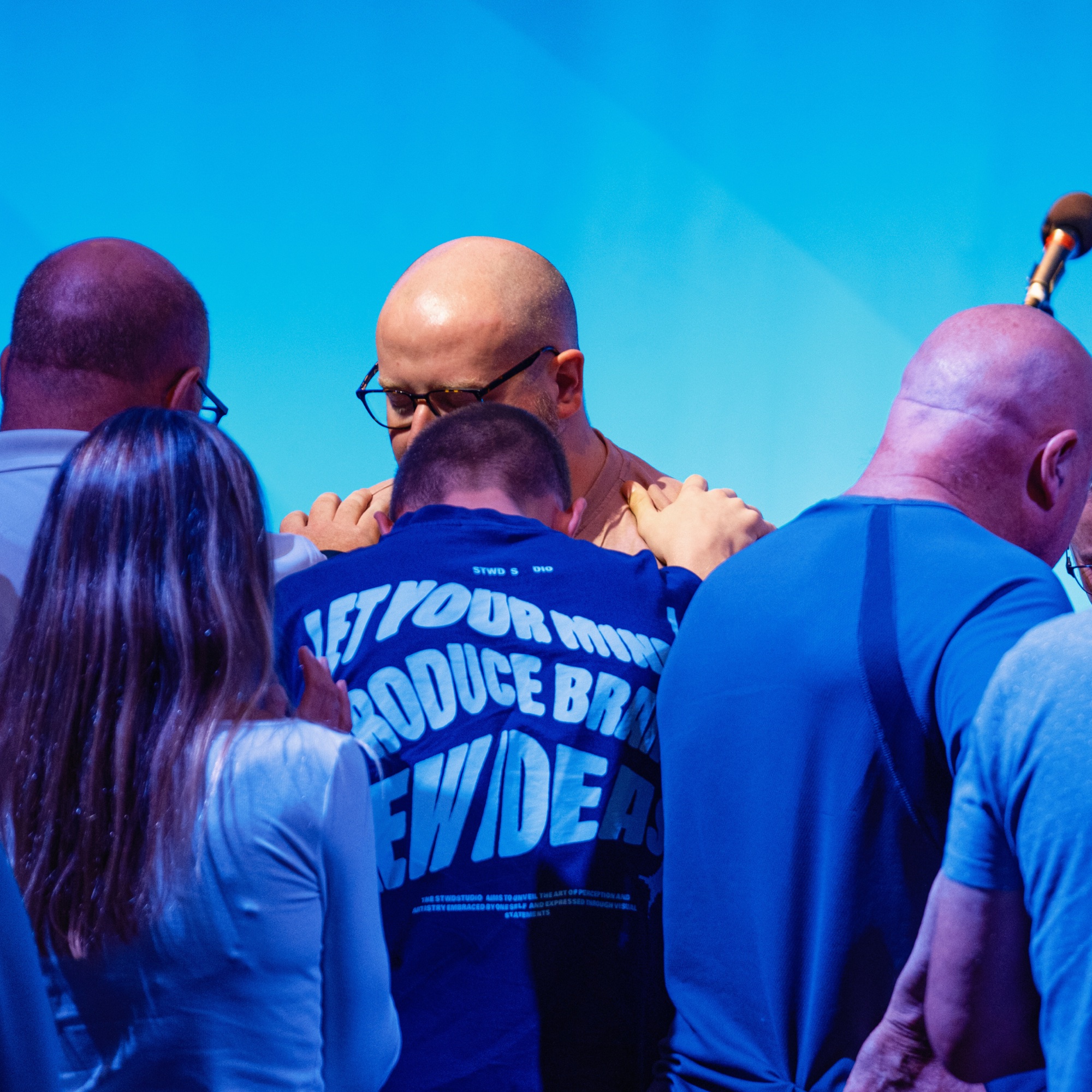 People gathered in quiet prayer together