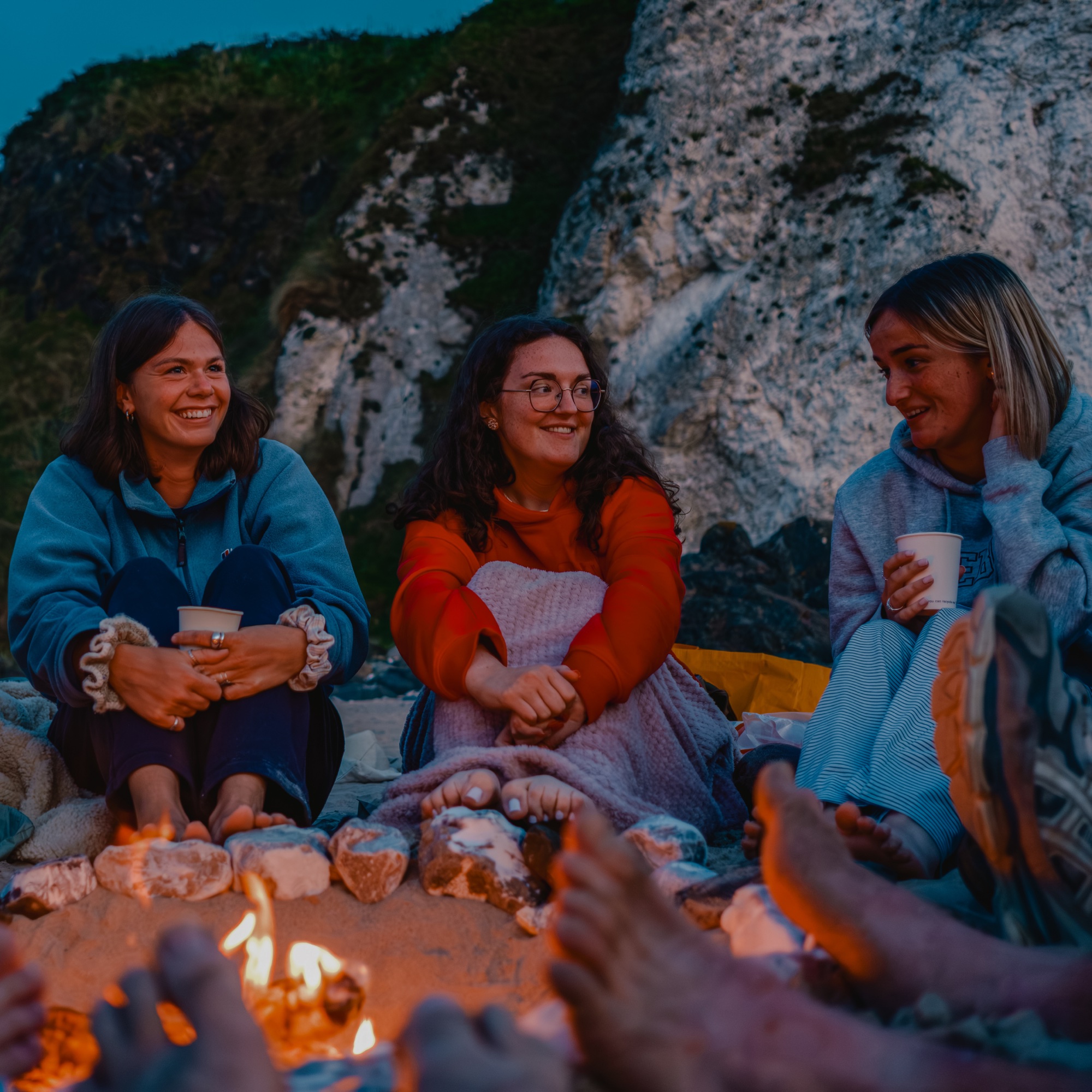 A group of young adults chatting together after a service